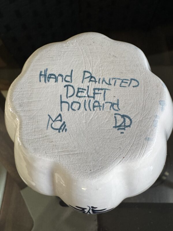 The upside-down English Ivy Teacup reveals a white, scalloped ceramic base textured like ivy leaves. 