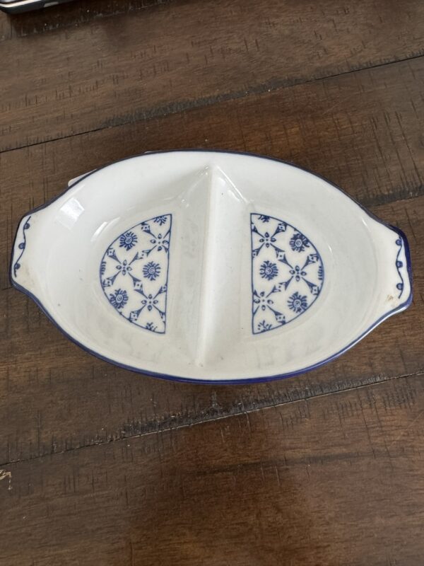 A white and blue dish on a wood surface.