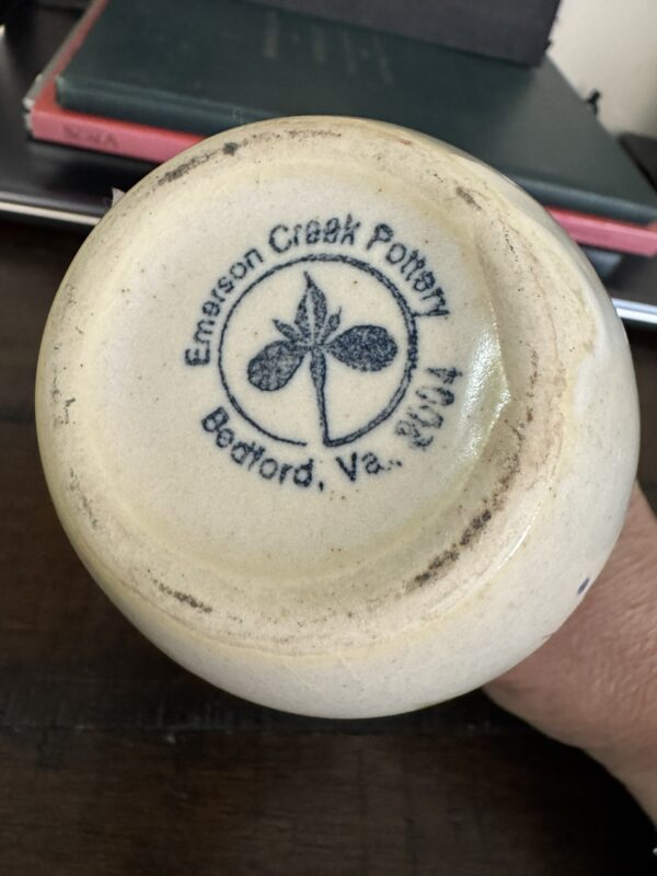 The bottom of the Woulind Chile Serving Dish displays a black butterfly stamp with 