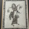 Traditional Balinese ink and watercolor drawing of a dancer in elaborate patterned attire, adorned with jewelry and headdress. The dancer strikes a dynamic pose, holding a dagger and a snake. Intricate floral border surrounds the artwork. Artist’s signature bottom right.