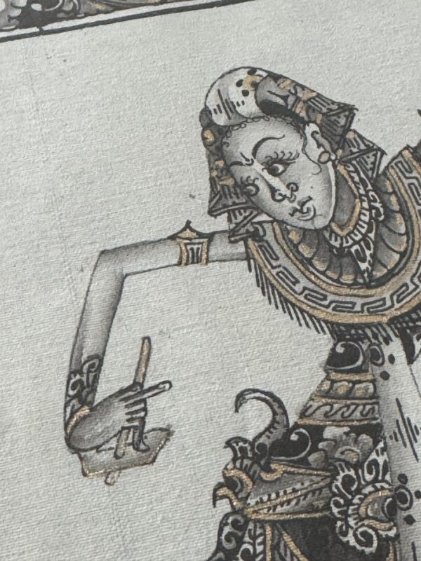 A detailed black-and-white illustration shows a traditional Indonesian wayang figure with intricate patterns on its clothing and jewelry. The figure has a long, arched arm, elongated fingers, and expressive facial features drawn in a stylized manner.